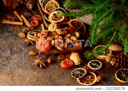 Dried fruits and nuts on a brown vintage background. Dried fruits and nuts on a brown vintage background. 132788176