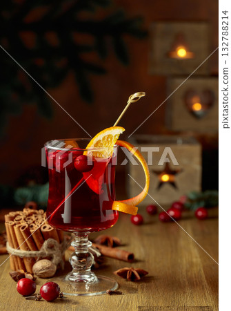 Christmas drink with spices, orange, and cranberries. Christmas drink with spices, orange, and cranberries. 132788214