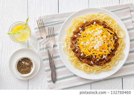 Cincinnati chili with spaghetti on white plate 132788460