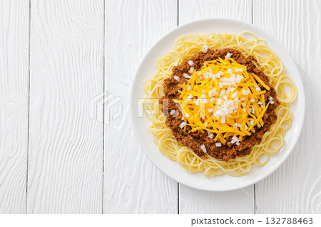 Cincinnati chili with spaghetti on white plate Cincinnati chili with spaghetti on white plate 132788463