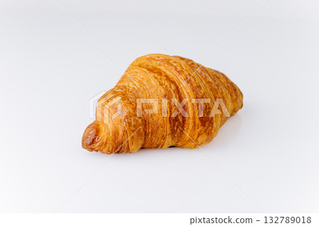 Fresh buttery croissant isolated on white background, perfect French breakfast pastry 132789018