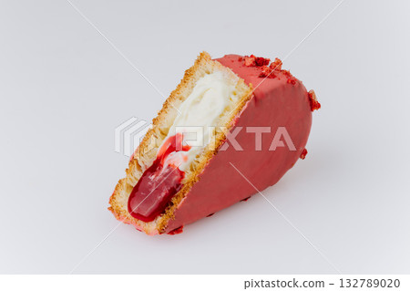 Heart-shaped croissant with red glaze, cream filling and berry jam on white background Heart-shaped croissant with red glaze, cream filling and berry jam on white background 132789020