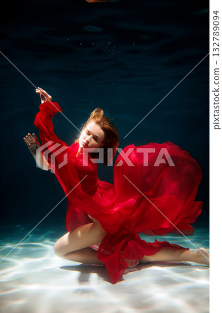 Rhythmic aquatic ballet featuring intense colors and flowing 132789094