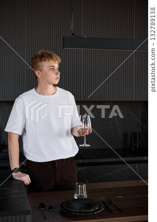 Gentle scene of solitary tasting at minimalist table setting Gentle scene of solitary tasting at minimalist table setting 132789138