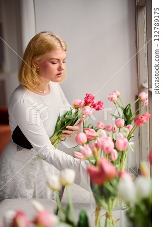 Intimate bridal moment with blush pink floral arrangement Intimate bridal moment with blush pink floral arrangement 132789175