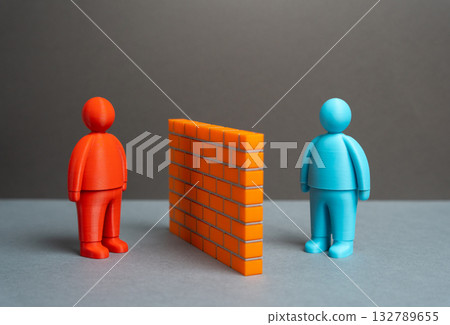 Two people separated by a brick wall. Misunderstandings and language barriers. Stereotypes. Finding common ground and gaining trust. Social conflict, isolation, cross-cultural understanding Two people separated by a brick wall. Misunderstandings and language barriers. Stereotypes. Finding common ground and gaining trust. Social conflict, isolation, cross-cultural understanding 132789655