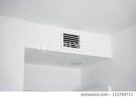 Ventilation grille and air duct in modern white minimalist room interior Ventilation grille and air duct in modern white minimalist room interior 132789713