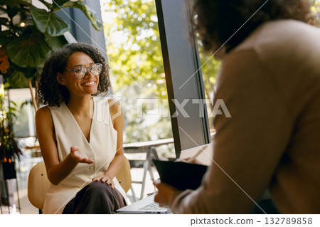 proposal exchange in progress, formal negotiation with visual aids in contemporary environment 132789858