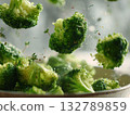 Fresh broccoli florets flying, cooking vegetable close-up, healthy food concept photo. Sprinkling spices, vibrant green color, raw or steamed. Dynamic photo of flying broccoli florets. 132789859