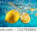 Fresh lemons splashing in water, dynamic citrus fruit close-up, healthy drink concept photo. Vibrant yellow color, whole fruit and slice, refreshing action. Dynamic photo of lemons splashing. 132789860