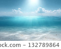 Ocean surface glows under sunny sky, with beams of light touching seabed. Great for sea and relaxation themes. 132789864
