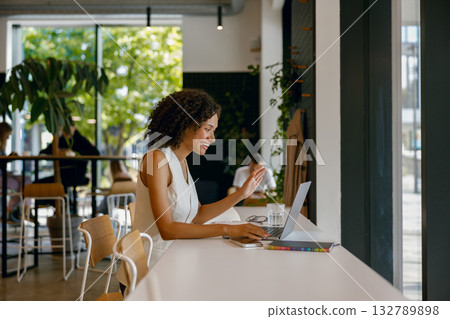 female working outdoors, lady studying in sunny cafe, woman researching campaign ideas in cozy cafe female working outdoors, lady studying in sunny cafe, woman researching campaign ideas in cozy cafe 132789898