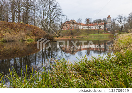 Historic castle and manor reflected in calm lakeside wate Historic castle and manor reflected in calm lakeside wate 132789939