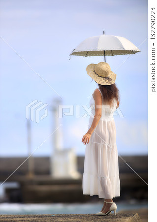 Woman with a parasol Woman with a parasol 132790223