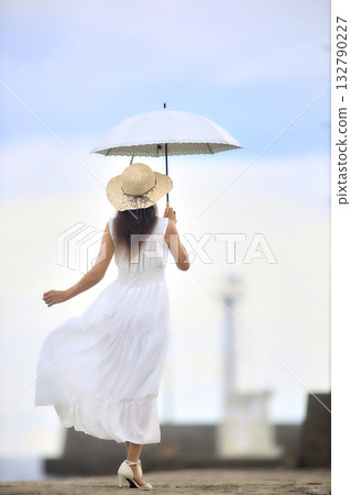 Woman with a parasol Woman with a parasol 132790227