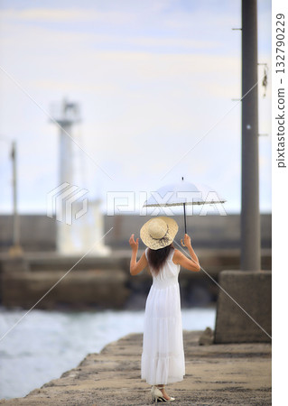 Woman with a parasol Woman with a parasol 132790229