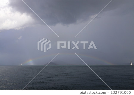 Sailing under the rainbow in the Aegean Sea. Sailing under the rainbow in the Aegean Sea. 132791000