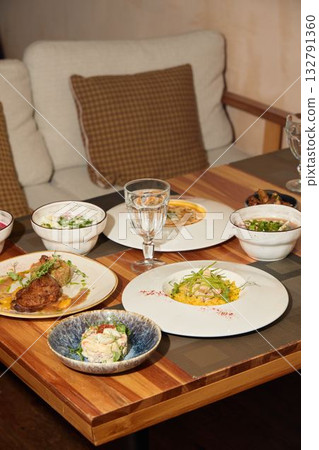 A Flavorful HomeCooked Meal Delightfully Spread Across a Beautiful Table, Perfect for Enjoying 132791360