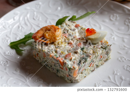 Olivier salad, vinaigrette salad and tartlets. Traditional russian appetizer for celebrating new year eve. Festive table setting. 132791600