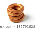 A pyramid of salted pretzels with poppy seeds isolated on a white background. 132791628