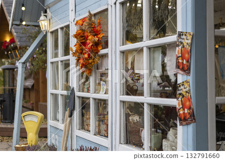 Blue wooden house decorated with autumn decorations, agricultural exhibition, Thanksgiving, Harvest Day Blue wooden house decorated with autumn decorations, agricultural exhibition, Thanksgiving, Harvest Day 132791660