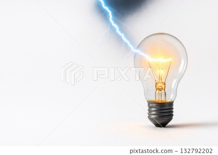 Lightning hits a burning bulb. Space for text. 132792202