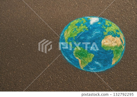 A chalk-drawn globe on the asphalt. Space for text. 132792295