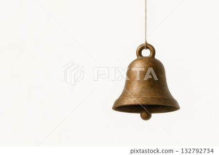 An antique bronze bell on a light background. Space for text. 132792734