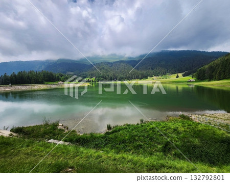 Alpine Lake Meadow under Stormy Clouds Alpine Lake Meadow under Stormy Clouds 132792801