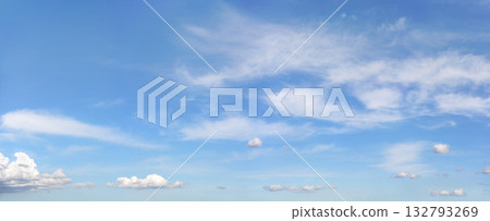 Bright sky background with few cirrus clouds above and small ones in lower part 132793269