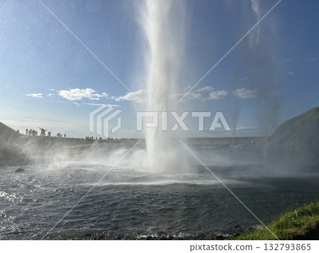 This is a view of the waterfall and the violent spray from behind the pool of Seljalandsfoss, a waterfall in southern Iceland. This is a view of the waterfall and the violent spray from behind the pool of Seljalandsfoss, a waterfall in southern Iceland. 132793865