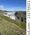 Gullfoss, the Golden Waterfall, is a waterfall in southern Iceland, with a beautiful rainbow miraculously appearing in the foreground. 132794021