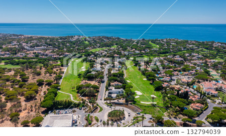 Vale de Lobo, Quinta de Lago, Faro, Portugal, aerial, Serene coastal neighborhood, Exclusive residential area with panoramic sea views, Prestigious villa complex Vale de Lobo, Quinta de Lago, Faro, Portugal, aerial, Serene coastal neighborhood, Exclusive residential area with panoramic sea views, Prestigious villa complex 132794039