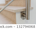 Closeup of marble staircase features, Architectural element showcasing polished stone and clamps, Stainless steel bracket reveals mounting hardware on marble stairs 132794068