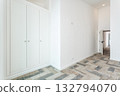 Bright minimalist entryway with builtin wardrobes staged for real estate listing, patterned tile floor, neutral white walls, ample storage, soft natural light, move-in 132794070
