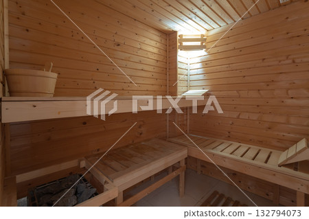 Serene wooden sauna with comfort, Relaxing environment featuring cedarpaneled sauna interior, Warm cedarlined sauna with tiered benches and gentle lighting for peace Serene wooden sauna with comfort, Relaxing environment featuring cedarpaneled sauna interior, Warm cedarlined sauna with tiered benches and gentle lighting for peace 132794073