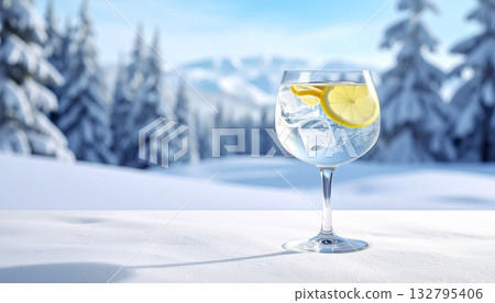 A winter scene of lemon-scented gin against a snowy matte background 132795406