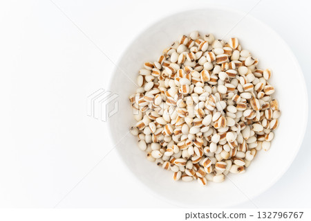 Job's tears in a plate on a white background Job's tears in a plate on a white background 132796767