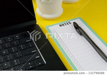 Laptop notepad and pen on desk 132798086