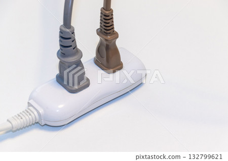 Plug inserted into a power strip 132799621