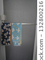 Towels hanging on the towel rack on the bathroom door 132800216