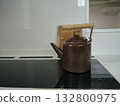 Enamel kettle in the kitchen 132800975