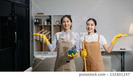Efficient and professional housekeeping with our dynamic cleaning duo. Perfect teamwork ensures spotless cleanliness Efficient and professional housekeeping with our dynamic cleaning duo. Perfect teamwork ensures spotless cleanliness 132801247