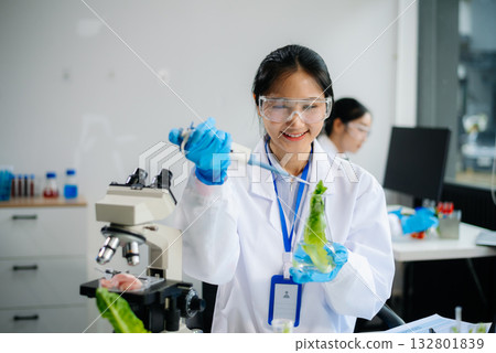 Food scientists in lab coats, testing samples, and analyzing food safety and quality Food scientists in lab coats, testing samples, and analyzing food safety and quality 132801839