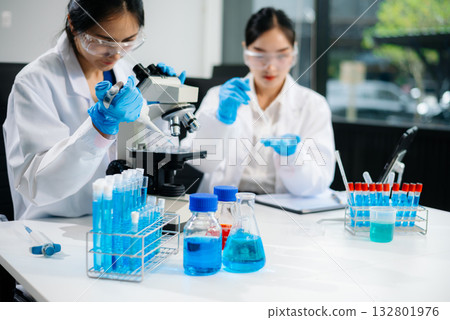 Female Scientists Conducting Chemistry Research in Modern Laboratory 132801976