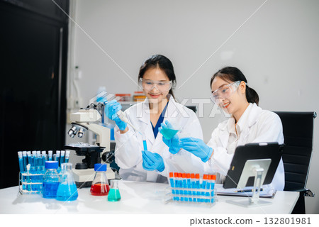 Female Scientists Conducting Chemistry Research in Modern Laboratory 132801981
