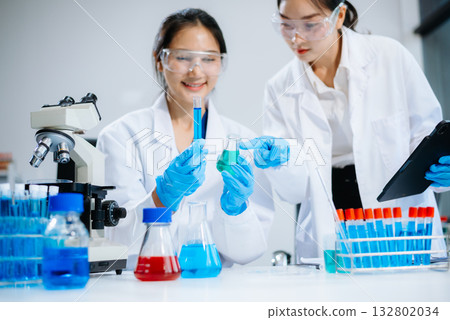 Female Scientists Conducting Chemistry Research in Modern Laboratory Female Scientists Conducting Chemistry Research in Modern Laboratory 132802034