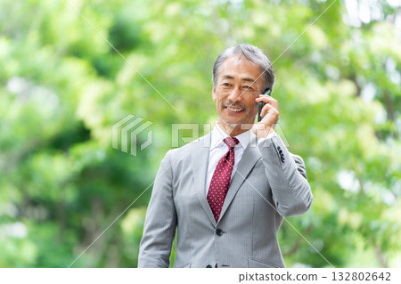 Business senior male smartphone call Business senior male smartphone call 132802642