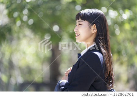 Smiling female high school student profile Smiling female high school student profile 132802701