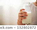 clean child holding milk bottle background 132802872